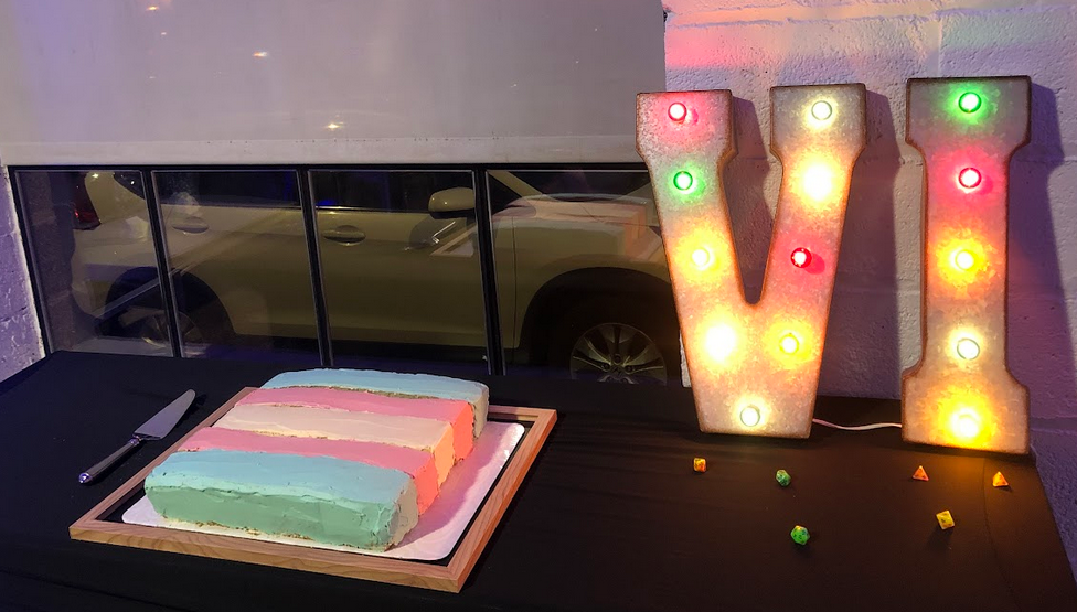 A cake in the shape of the trans pride flag